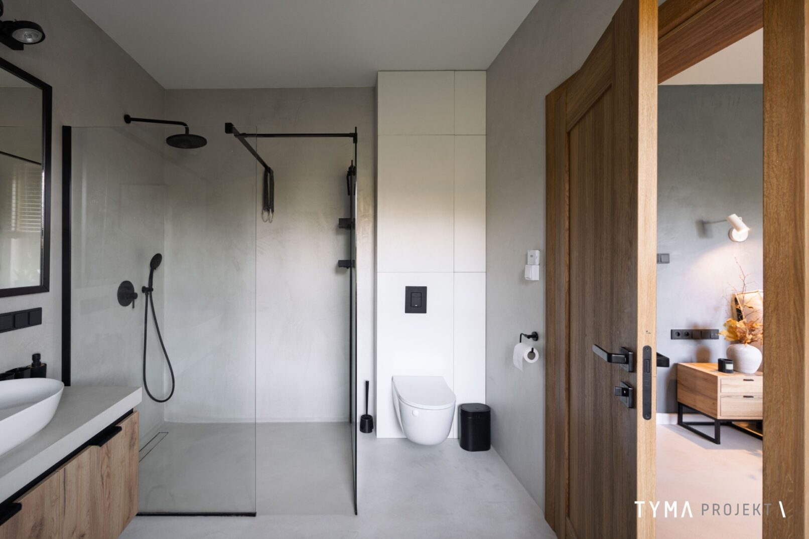 Minimalistyczna łazienka wykończona mikrocementem.